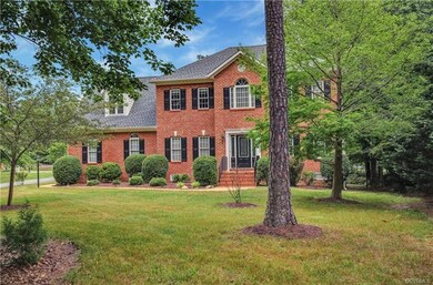 The yard is spacious and includes a fenced-in rear