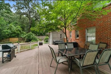 Wooden deck featuring area for grilling