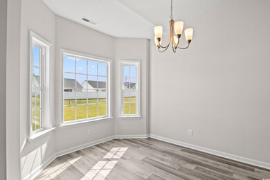 Unfurnished room with light wood-type flooring, a 