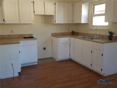 Sunny new kitchen with new counters, new faucets,
