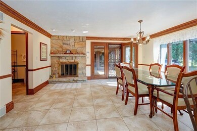 Combo Kit w eat-in space has stone fireplace