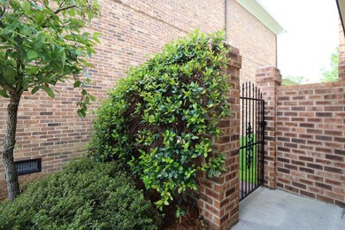 brick fence / wrought iron gate
