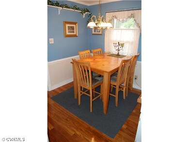 Breakfast Nook - Kitchen: eat-in with hardwood floor, tiled countertops, double wall ovens, electric cook top, double drawer stainless steel dishwasher, work station area, white cabinets with crown molding and chair rail and pantry