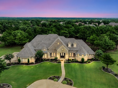 View of front of property with stone siding, a front lawn, and brick siding
