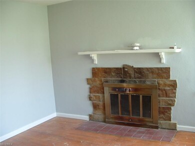 Wood burning fireplace in great room.  Walls paint