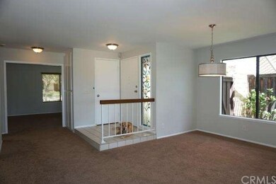Dining room off entry with large picture window to