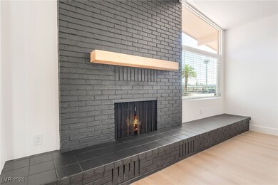 Detailed view of a brick fireplace, wood finished