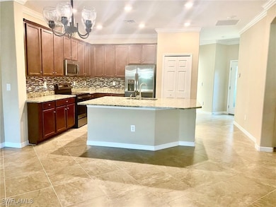 Kitchen featuring stainless steel appliances, a si