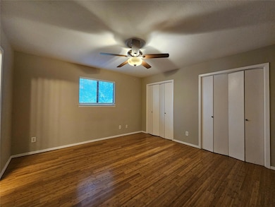 Unfurnished bedroom featuring wood finished floor