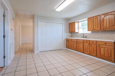 Kitchen.  Utility Area with Washer & Dryer be hide
