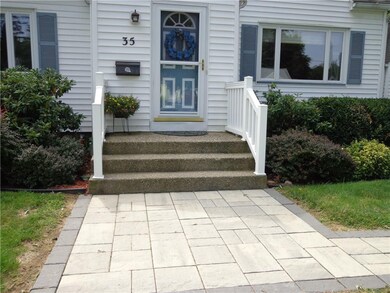 Note the beautiful paver walkway and welcoming fro