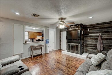 Living area with fireplace and awesome wood wall!!