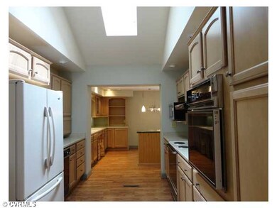 Kitchen - Galley style kitchen  has a casual dinin