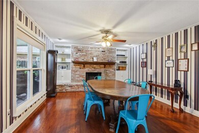 DINING ROOM WITH GAS FIREPLACE AND REAL WOOD FLOOR