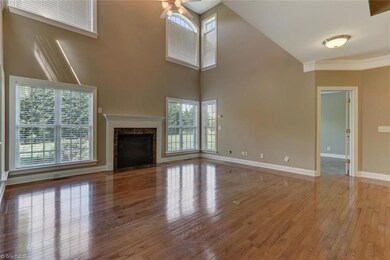Great room and living space with many large windows for natural lighting as well as a gas fireplace, perfect for cold winters.
