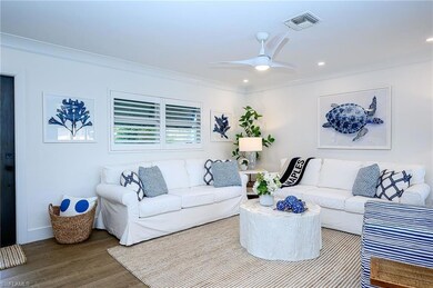 Living room with ceiling fan, hardwood / wood-styl