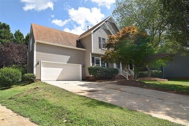 Two car, front load garage; concrete drive; and ma
