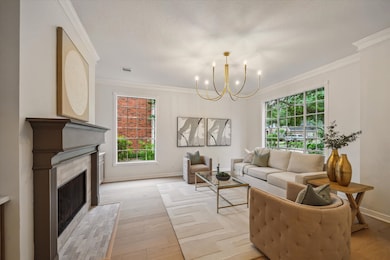 AN ELEGANT FORMAL LIVING ROOM TO YOUR RIGHT BOASTS