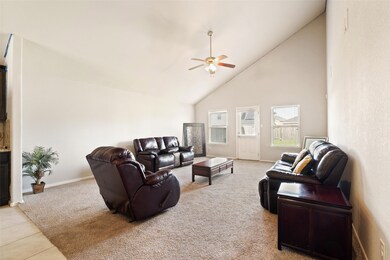 Bright and spacious living room feauting vaulted c