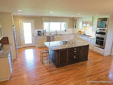 Kitchen. Features fabulous chef s kitchen with top of the line fixtures, appliances and cabinets!