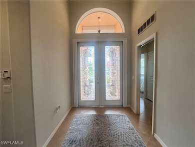 Foyer entrance with plenty of natural light, frenc
