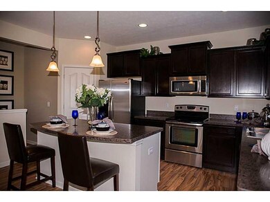 Kitchen. Photo is of a similar model & floor plan.