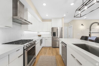 Kitchen with Stainless Steel Appliances, Wall Chimney Range Hood.