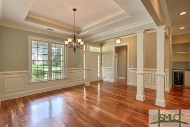 Dining room has a tray ceiling and is large enough