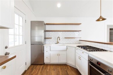 Updated Kitchen with Quartz, Stainless Steel and Subway Tile