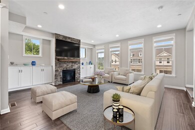 Large, open family room area virtually 
staged.