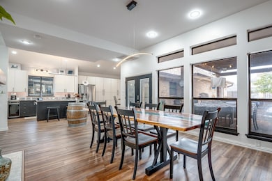 Dining space featuring wood finished floors and re