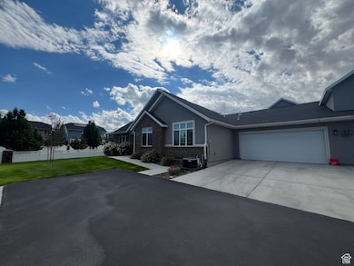 Ranch-style house featuring stucco siding, concrete driveway, and a garage