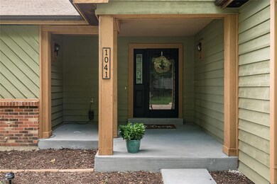 Spacious front porch. Newer concrete.