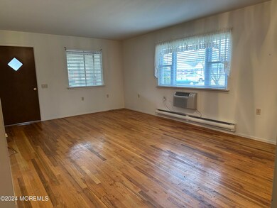 Living room and dining room with exposed