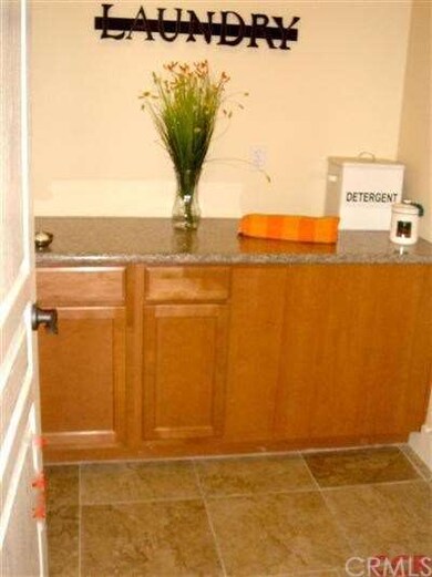 Indoor laundry with cabinet storage