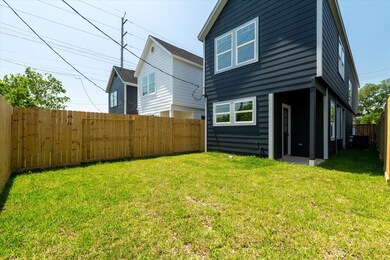 Fully fenced backyard with a covered patio, perfec