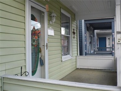 Relax on the 7X14 covered front porch.