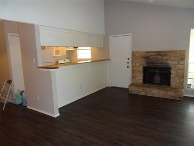 Unfurnished living room featuring dark wood finis