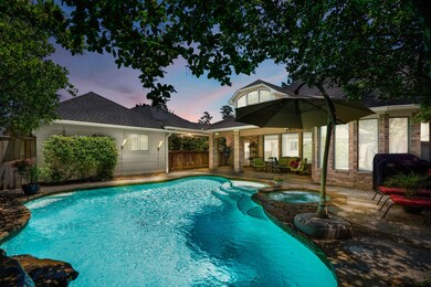 Out in the backyard is a large covered patio, spar