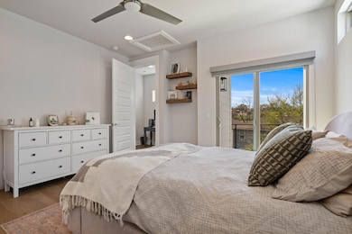 Bedroom featuring access to exterior, ceiling fan