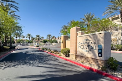 Community / neighborhood sign featuring a gate