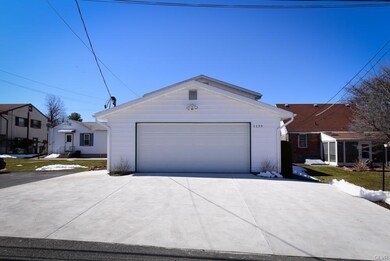 Large oversized two car garage with newer concrete