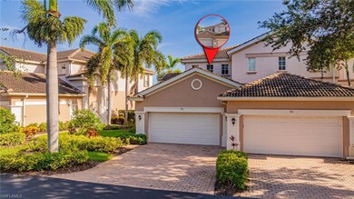 Mediterranean / spanish home featuring stucco siding, decorative driveway, a tiled roof, and a garage