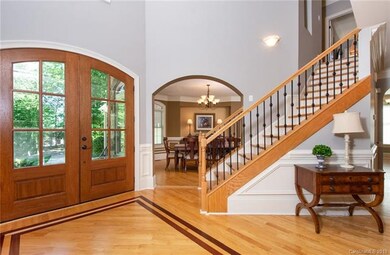 Enter the grand 2 story foyer and be welcomed by a