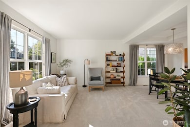 Spacious Living and dining rooms with new carpet and plenty of light