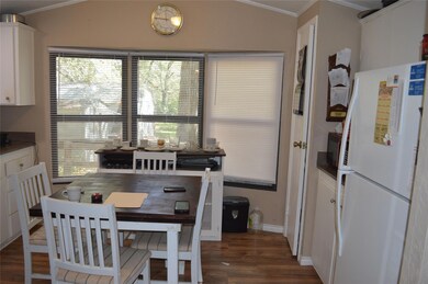Dining area with dark hardwood / wood-style floori