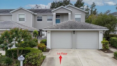 Traditional-style house with a garage, concrete driveway, stucco siding, and a tiled roof