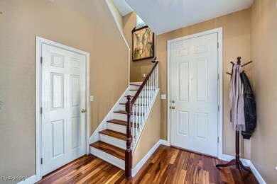 Entrance foyer featuring dark wood-style flooring