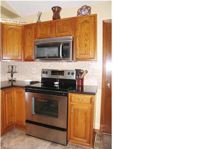 A closeup of the stainless range/oven and spacesav