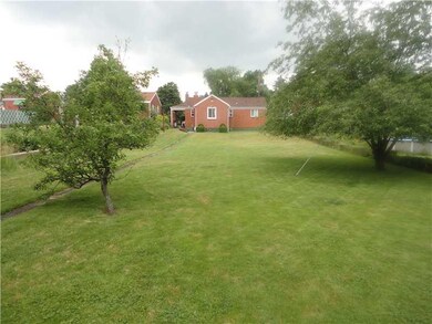 Exterior Back. LARGE LEVEL LOT